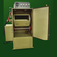 Load image into Gallery viewer, Clemco ZERO BNP 164 tumble barrel blast cabinet with the door open showing the rubber-lined barrel and drive wheels